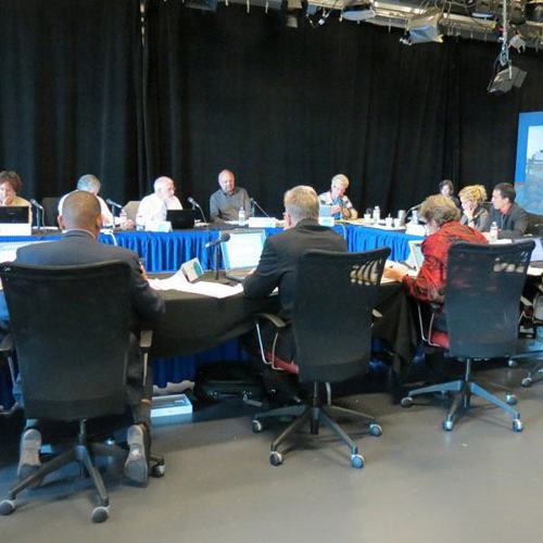 group of panelists sitting around a table